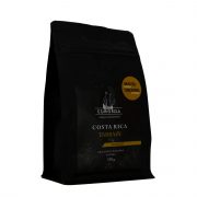 Curonia costa rica tarrazu malta kafija melnā iepakojumā